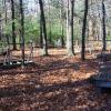 Several wooden tent platforms arranged in a circle at the Jack Pine tent site.