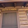 Entrance to Roth Cabin with a sign that says "Roth Cabin."